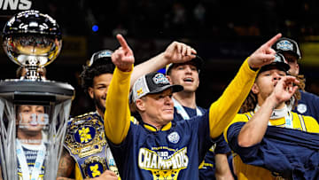 Michigan head coach Dusty May acknowledges the fans as the team celebrate 59-53 win over Wisconsin to win the Big Ten Tournament championship game at Gainbridge Fieldhouse in Indianapolis, Ind. on Sunday, March 16, 2025.