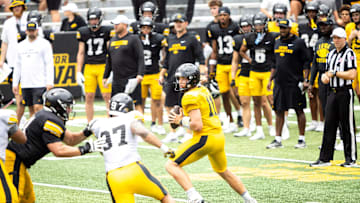 Aug 9, 2025; Iowa quarterback Mark Gronowski (11) drops back to pass during the Hawkeyes Kids Day NCAA football open practice at Kinnick Stadium in Iowa City, Iowa. Mandatory Credit: Joseph Cress for the Des Moines Register