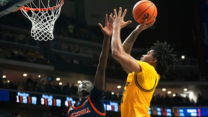 Iowa's Tavion Banks attempts a shot against Bucknell's Ruot Bijiek during a game at Casey's Center on Saturday, Dec. 20, 2025 in Des Moines.