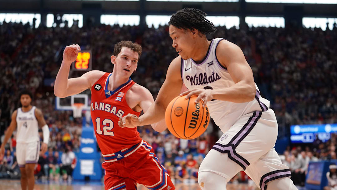 Kansas State Exavier Wilson drives against Kansas guard Wilder Evers during the Sunflower Showdown game inside Allen Fieldhouse in Lawrence.