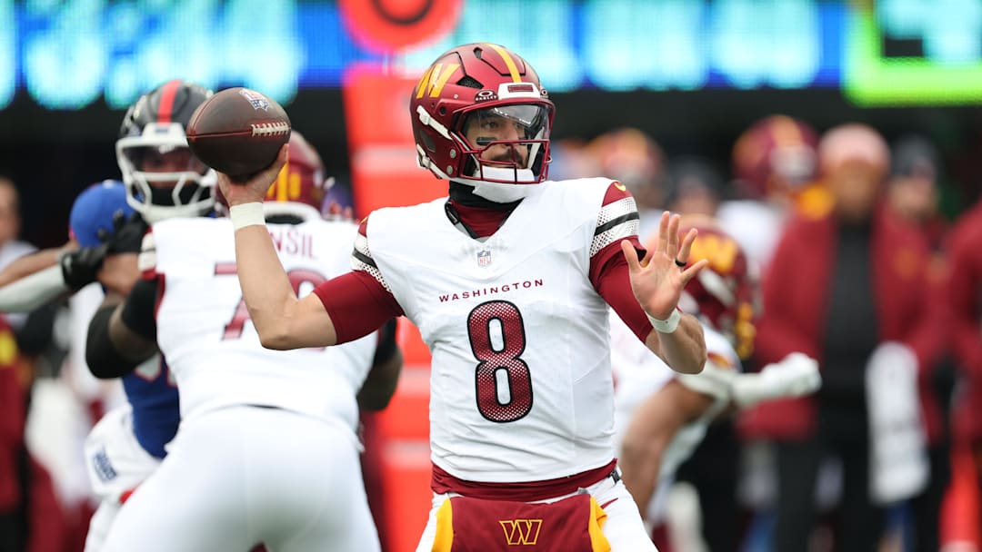 Dec 14, 2025; East Rutherford, New Jersey, USA;  Washington Commanders quarterback Marcus Mariota (8) looks to pass during the first quarter against the New York Giants at MetLife Stadium. Mandatory Credit: Vincent Carchietta-Imagn Images