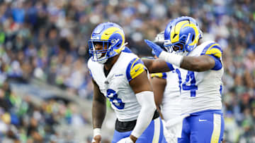 Nov 3, 2024; Seattle, Washington, USA; Los Angeles Rams linebacker Jared Verse (8) celebrates with cornerback Cobie Durant (14) after a sack against the Seattle Seahawks during the second quarter at Lumen Field. Mandatory Credit: Joe Nicholson-Imagn Images