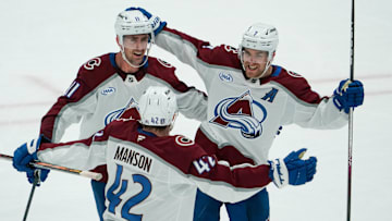 Apr 19, 2025; Dallas, Texas, USA; Colorado Avalanche defenseman Devon Toews (7) celebrates with center Brock Nelson (11) and defenseman Josh Manson (42) after scoring a goal against the Dallas Stars during the third period in game one of the first round of the 2025 Stanley Cup Playoffs at American Airlines Center. Mandatory Credit: Raymond Carlin III-Imagn Images