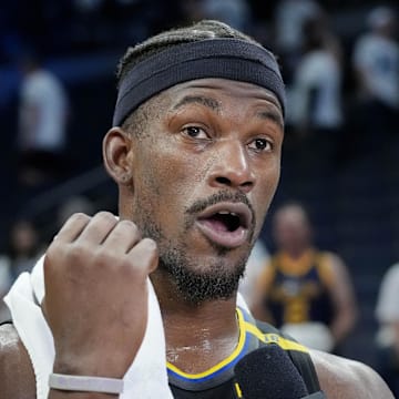 May 6, 2025; Minneapolis, Minnesota, USA; Golden State Warriors forward Jimmy Butler (10) conducts an interview after defeating the Minnesota Timberwolves during game one of the second round for the 2025 NBA Playoffs at Target Center. Mandatory Credit: Bruce Kluckhohn-Imagn Images