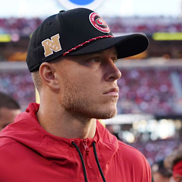 Sep 9, 2024; Santa Clara, California, USA; San Francisco 49ers running back Christian McCaffrey (23) watches from the sideline due to injury during the second quarter against the New York Jets at Levi's Stadium. Mandatory Credit: David Gonzales-Imagn Images