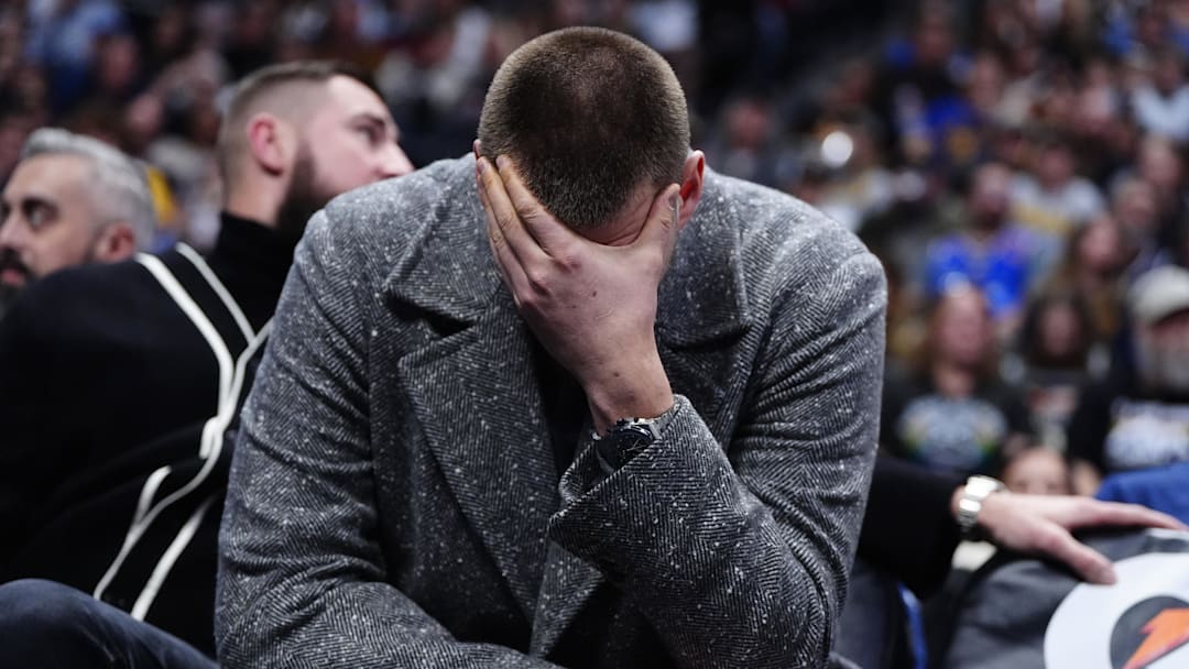 Jan 18, 2026; Denver, Colorado, USA; Denver Nuggets center Nikola Jokic (15) reacts from the bench in the third quarter against the Charlotte Hornets at Ball Arena. Mandatory Credit: Ron Chenoy-Imagn Images