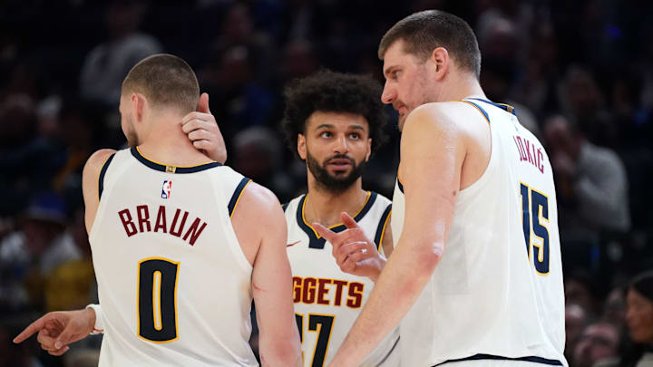 Feb 22, 2026; San Francisco, California, USA;  Denver Nuggets guard Jamal Murray (27) talks with guard Christian Braun (0) and center Nikola Jokic (15) in the fourth quarter against the Golden State Warriors at Chase Center. Mandatory Credit: David Gonzales-Imagn Images