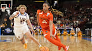 Mar 26, 2023; Greenville, SC, USA; Miami Hurricanes guard Jasmyne Roberts (4) drives to the basket against LSU Lady Tigers guard Kateri Poole (55) during the second half of the NCAA Women   s Tournament at Bon Secours Wellness Arena. Mandatory Credit: Jim Dedmon-Imagn Images