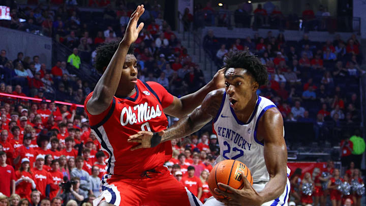Feb 4, 2025; Oxford, Mississippi, USA; Kentucky Wildcats center Amari Williams (22) drives to the basket as Mississippi Rebels forward Malik Dia (0) defends during the first half at The Sandy and John Black Pavilion at Ole Miss. Mandatory Credit: Petre Thomas-Imagn Images