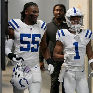 Indianapolis Colts linebacker Isaiah Land (55) and Indianapolis Colts wide receiver Josh Downs (1) make their way to the field Sunday, Dec. 24, 2023, before a game against the Atlanta Falcons at Mercedes-Benz Stadium in Atlanta.