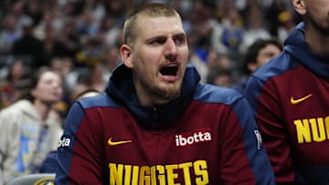 Mar 15, 2025; Denver, Colorado, USA; Denver Nuggets center Nikola Jokic (15) reacts from the bench in the second quarter against the Washington Wizards at Ball Arena. Mandatory Credit: Ron Chenoy-Imagn Images