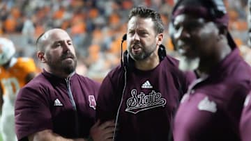 Nov 9, 2024; Knoxville, Tennessee, USA; Mississippi State Bulldogs defensive coordinator Coleman Hutzler is held back by assistant coach Matt Holecek as yells at officials as on a pass interference call  against the Tennessee Volunteers during the second half at Neyland Stadium. Mandatory Credit: Saul Young/USA TODAY Network via Imagn Images
