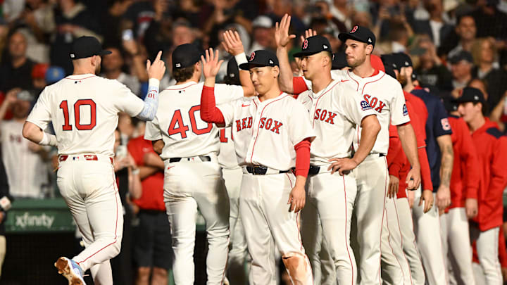 Sep 14, 2025; Boston, Massachusetts, USA; Boston Red Sox shortstop Trevor Story (10) high-fives left fielder Masataka Yoshida (7) after a game against the New York Yankees at Fenway Park. Mandatory Credit: Brian Fluharty-Imagn Images