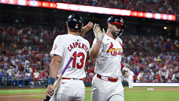 May 26, 2024; St. Louis, Missouri, USA;  St. Louis Cardinals first baseman Paul Goldschmidt (46) is congratulated by designated hitter Matt Carpenter (13) after hitting a two run home run against the Chicago Cubs during the third inning at Busch Stadium. Mandatory Credit: Jeff Curry-USA TODAY Sports