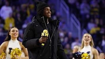 Dec 7, 2024; Ann Arbor, Michigan, USA;  Michigan Wolverines quarterback commit Bryce Underwood addresses the crowd during a basketball game against the Iowa Hawkeyes at Crisler Center. Mandatory Credit: Rick Osentoski-Imagn Images
