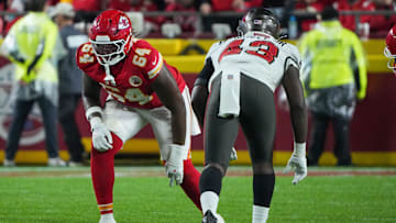 Nov 4, 2024; Kansas City, Missouri, USA; Kansas City Chiefs offensive tackle Wanya Morris (64) at the line of scrimmage against the Tampa Bay Buccaneers during the game at GEHA Field at Arrowhead Stadium. Mandatory Credit: Denny Medley-Imagn Images