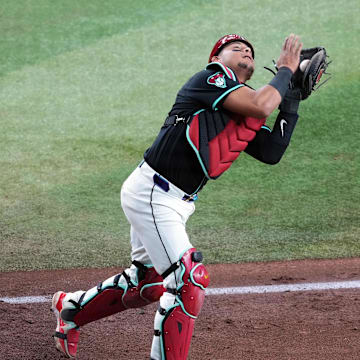 May 4, 2024; Phoenix, Arizona, USA; Arizona Diamondbacks catcher Gabriel Moreno (14) catches a pop up against the San Diego Padres during the sixth inning at Chase Field. Mandatory Credit: Joe Camporeale-Imagn Images