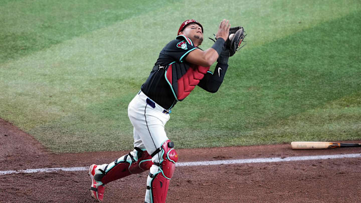 May 4, 2024; Phoenix, Arizona, USA; Arizona Diamondbacks catcher Gabriel Moreno (14) catches a pop up against the San Diego Padres during the sixth inning at Chase Field. Mandatory Credit: Joe Camporeale-Imagn Images