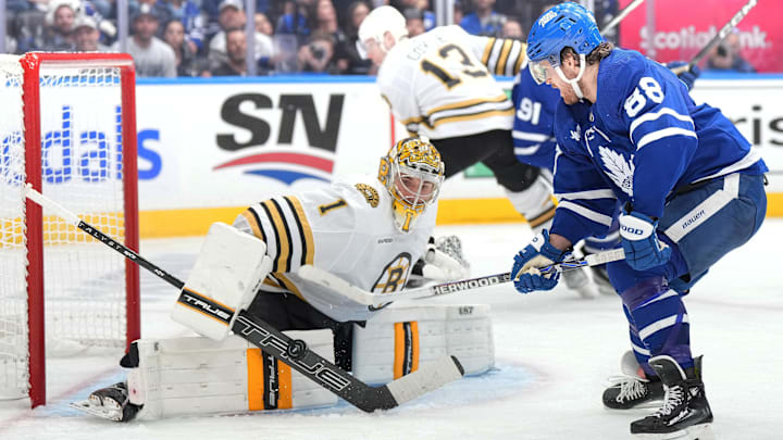 Apr 27, 2024; Toronto, Ontario, CAN; Toronto Maple Leafs right wing William Nylander (88) battles for the puck in front of Boston Bruins goaltender Jeremy Swayman (1) during the third period in game four of the first round of the 2024 Stanley Cup Playoffs at Scotiabank Arena. Mandatory Credit: Nick Turchiaro-USA TODAY 