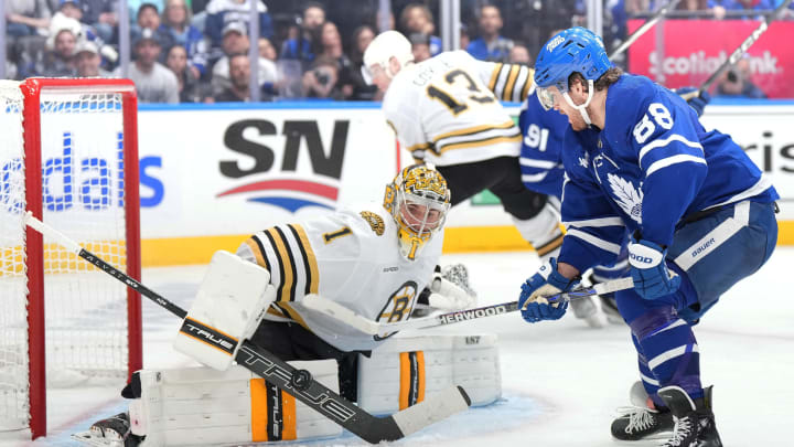 Apr 27, 2024; Toronto, Ontario, CAN; Toronto Maple Leafs right wing William Nylander (88) battles for the puck in front of Boston Bruins goaltender Jeremy Swayman (1) during the third period in game four of the first round of the 2024 Stanley Cup Playoffs at Scotiabank Arena. Mandatory Credit: Nick Turchiaro-USA TODAY