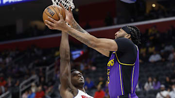 Nov 4, 2024; Detroit, Michigan, USA; Los Angeles Lakers forward Anthony Davis (3) shoots on Detroit Pistons center Jalen Duren (0) in the first half at Little Caesars Arena. Mandatory Credit: Rick Osentoski-Imagn Images