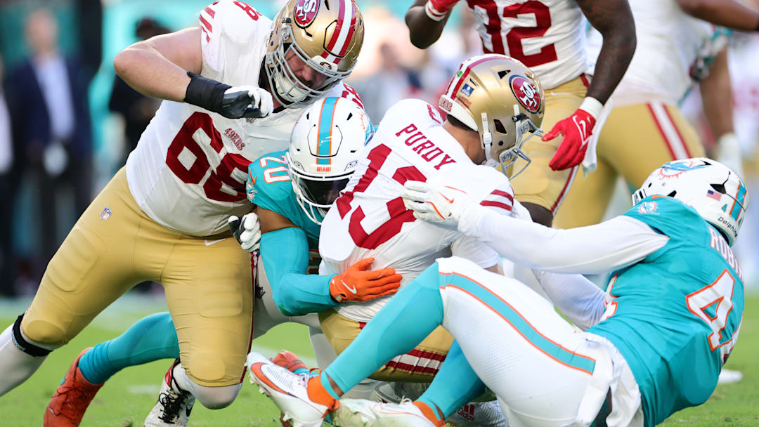San Francisco 49ers quarterback Brock Purdy is taken down by Miami Dolphins linebacker Jordyn Brooks