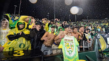 Fans cheer in the rain as the Oregon Ducks host the Wisconsin Badgers on Oct. 25, 2025, at Autzen Stadium in Eugene, Oregon.