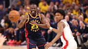 Apr 28, 2025; San Francisco, California, USA; Golden State Warriors forward Draymond Green (23) passes the ball against Houston Rockets forward/guard Amen Thompson (1) during the second quarter of game four of the 2025 NBA Playoffs first round at Chase Center. Mandatory Credit: Kelley L Cox-Imagn Images