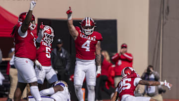 Oct 26, 2024; Bloomington, Indiana, USA; Indiana Hoosiers linebacker Aiden Fisher (4) celebrates a defensive stop during the second quarter of a game against the Washington Huskies at Memorial Stadium. Mandatory Credit: Jacob Musselman-Imagn Images