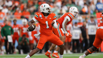 Dec 28, 2024; Orlando, FL, USA; Miami Hurricanes quarterback Cam Ward (1) drops back to pass against the Iowa State Cyclones in the first quarter during the Pop Tarts bowl at Camping World Stadium. Mandatory Credit: Nathan Ray Seebeck-Imagn Images