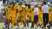 Oct 4, 2025; Waco, Texas, USA; Baylor Bears cornerback KJ Makins (14) and his teammates celebrate after defeating the Kansas State Wildcats in the second half at McLane Stadium. Mandatory Credit: Chris Jones-Imagn Images