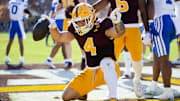 Arizona State Sun Devils running back Cam Skattebo (4) celebrates after scoring a first-half touchdown against the Brigham Young Cougars.