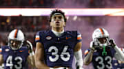 Nov 8, 2025; Charlottesville, Virginia, USA; Virginia Cavaliers safety Caleb Hardy (26) looks on from the field prior to the game against the Wake Forest Demon Deacons at Scott Stadium. Mandatory Credit: Amber Searls-Imagn Images