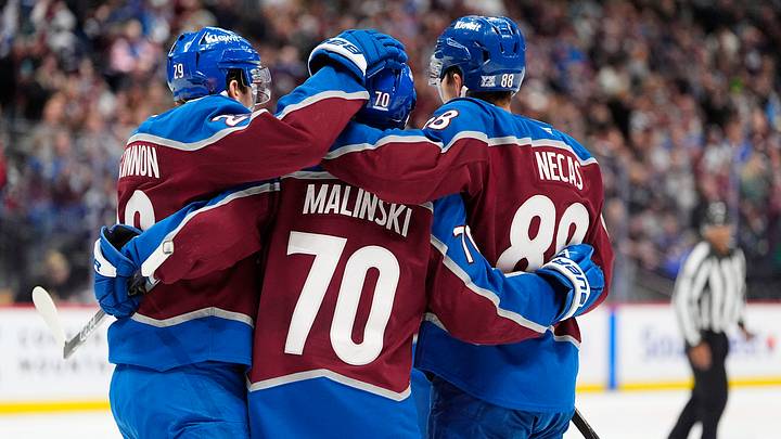 Colorado Avalanche defenseman Sam Malinski, center Martin Necas Colorado Avalanche defenseman Sam Malinski, center Martin Necas