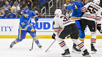 Mar 22, 2025; St. Louis, Missouri, USA;  St. Louis Blues center Jordan Kyrou (25) shoots against the Chicago Blackhawks during the second period at Enterprise Center. Mandatory Credit: Jeff Curry-Imagn Images
