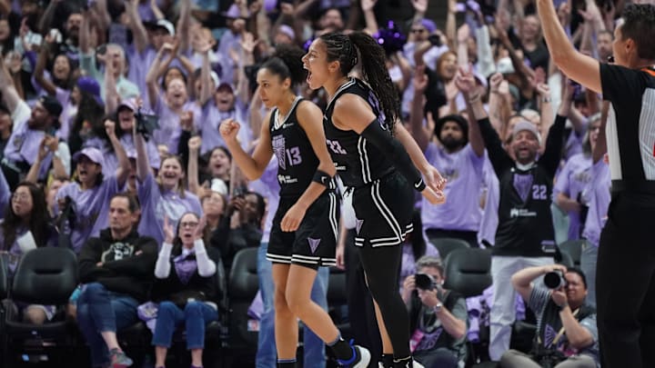 Golden State Valkyries guard Veronica Burton (22) and forward Janelle Salaun (13) celebrate after a basket against the Minnesota Lynx in the third quarter in game two of round one for the 2025 WNBA Playoffs at SAP Center. 