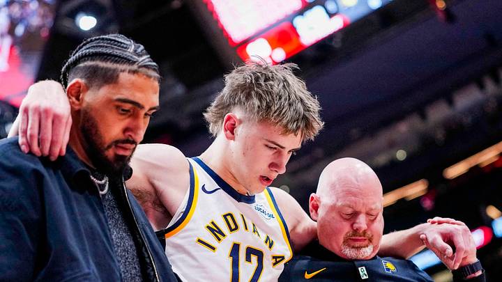 Feb 8, 2026; Toronto, Ontario, CAN; Indiana Pacers guard Johnny Furphy (12) leaves the game after injuring himself during the second half against the Toronto Raptors at Scotiabank Arena. Mandatory Credit: Kevin Sousa-Imagn Images