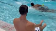Michael Phelps helped Ravens players, like defensive tackle Travis Jones, learn how to swim with the assistance of a pool noodle. 