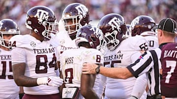 Oct 19, 2024; Starkville, Mississippi, USA;  Texas A&M Aggies running back Le'Veon Moss (8) reacts with teammates after a touchdown against the Mississippi State Bulldogs during the third quarter at Davis Wade Stadium at Scott Field. Mandatory Credit: Matt Bush-Imagn Images