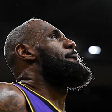 Mar 8, 2025; Boston, Massachusetts, USA; Los Angeles Lakers forward LeBron James (23) looks into the crowd during a timeout in the fourth quarter of a game against the Boston Celtics at the TD Garden. Mandatory Credit: Brian Fluharty-Imagn Images