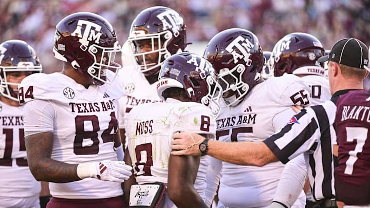 Oct 19, 2024; Starkville, Mississippi, USA;  Texas A&M Aggies running back Le'Veon Moss (8) reacts with teammates after a touchdown against the Mississippi State Bulldogs during the third quarter at Davis Wade Stadium at Scott Field. Mandatory Credit: Matt Bush-Imagn Images