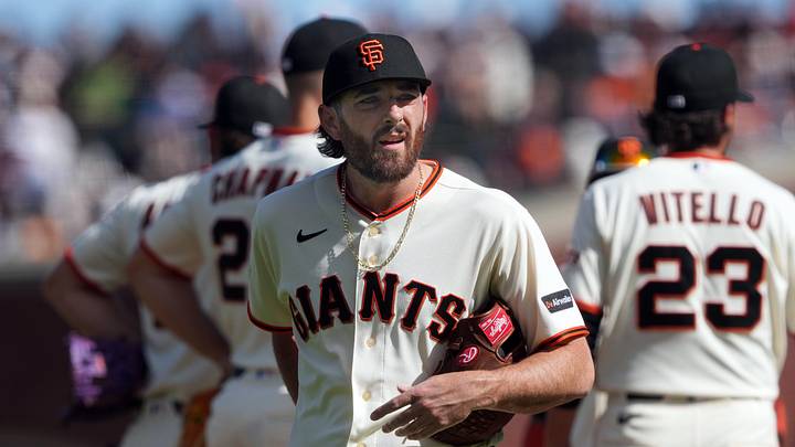 Mar 27, 2026; San Francisco, California, USA; San Francisco Giants pitcher Ryan Walker (center) walks to the dugout after being removed from the game during the eighth inning against the New York Yankees at Oracle Park. Mandatory Credit: Darren Yamashita-Imagn Images