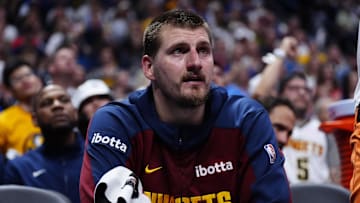 May 9, 2025; Denver, Colorado, USA; Denver Nuggets center Nikola Jokic (15) on the bench in the fourth quarter against the Oklahoma City Thunder during game three of the second round for the 2025 NBA Playoffs at Ball Arena. Mandatory Credit: Ron Chenoy-Imagn Images
