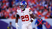Oct 19, 2025; Denver, Colorado, USA; New York Giants running back Tyrone Tracy Jr. (29) reacts after a play during the second half against the Denver Broncos at Empower Field at Mile High. Mandatory Credit: Ron Chenoy-Imagn Images
