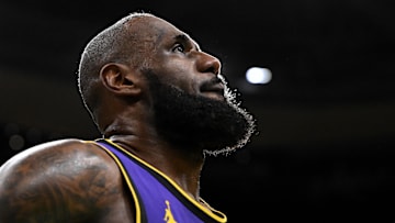 Mar 8, 2025; Boston, Massachusetts, USA; Los Angeles Lakers forward LeBron James (23) looks into the crowd during a timeout in the fourth quarter of a game against the Boston Celtics at the TD Garden. Mandatory Credit: Brian Fluharty-Imagn Images