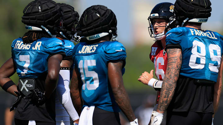 Jacksonville Jaguars quarterback Trevor Lawrence (16) huddles with tight end Luke Farrell (89), wide receiver Tim Jones (15) and wide receiver Brian Thomas Jr. (7) during a combined NFL football training camp session between the Tampa Bay Buccaneers and Jacksonville Jaguars Wednesday, Aug. 14, 2024 at EverBank Stadium’s Miller Electric Center in Jacksonville, Fla. [Corey Perrine/Florida Times-Union]