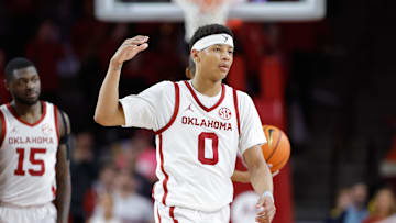 Feb 22, 2025; Norman, Oklahoma, USA; Oklahoma Sooners guard Jeremiah Fears (0) gestures to his team between plays against the Mississippi State Bulldogs during the second half at Lloyd Noble Center. Mandatory Credit: Alonzo Adams-Imagn Images