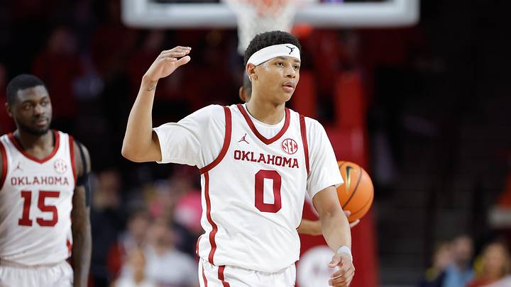 Feb 22, 2025; Norman, Oklahoma, USA; Oklahoma Sooners guard Jeremiah Fears (0) gestures to his team between plays against the Mississippi State Bulldogs during the second half at Lloyd Noble Center. Mandatory Credit: Alonzo Adams-Imagn Images