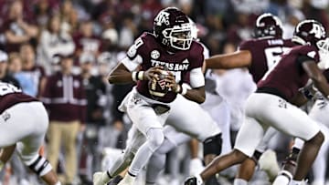 Nov 30, 2024; College Station, Texas, USA; Texas A&M Aggies quarterback Marcel Reed (10) runs the ball during the first half against the Texas Longhorns. The Longhorns defeated the Aggies 17-7 at Kyle Field. Mandatory Credit: Maria Lysaker-Imagn Images  