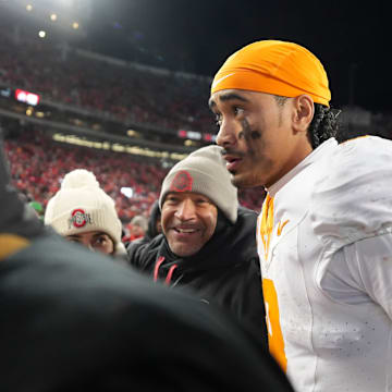 Iamaleava walks off the field after a game. 